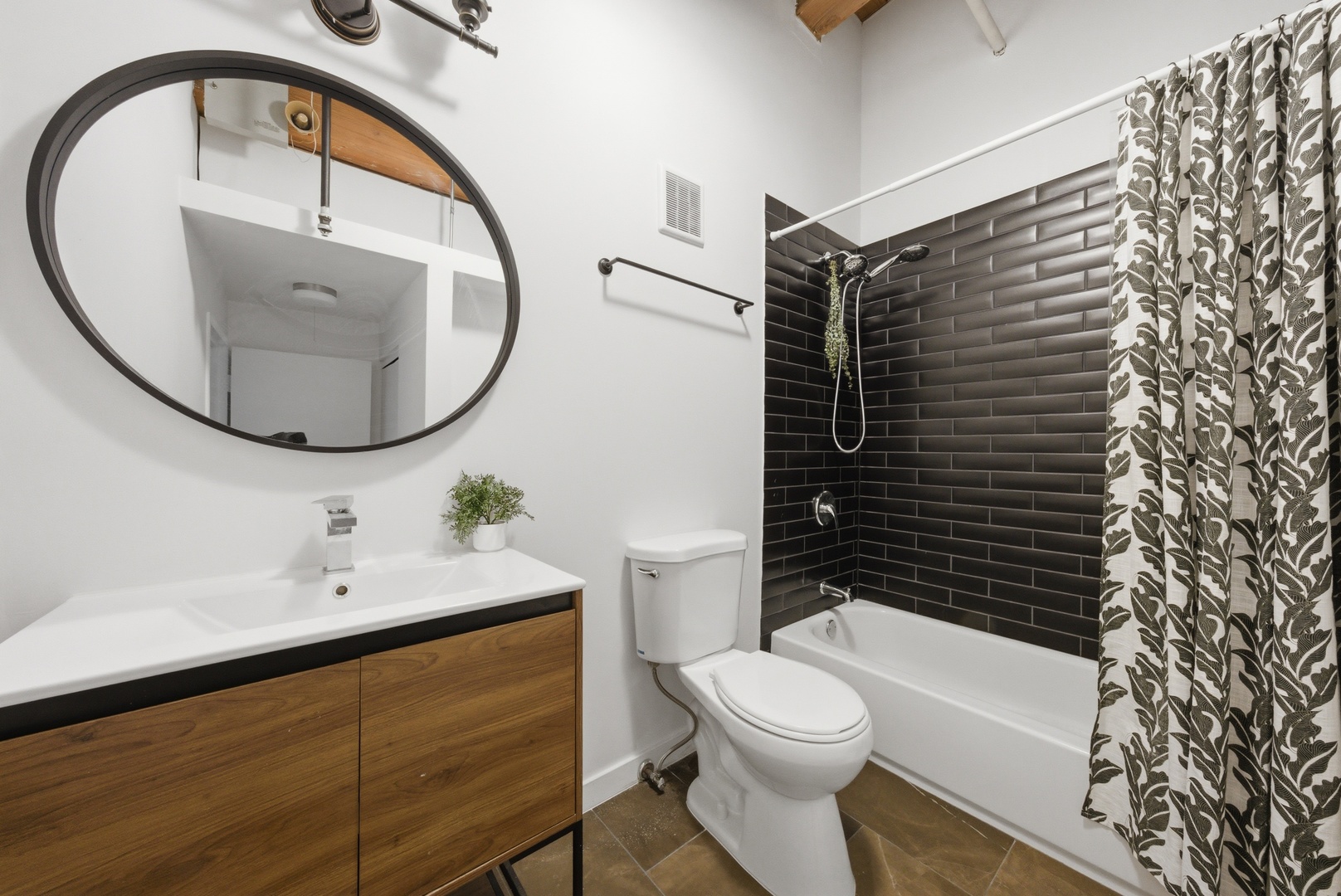 400 South Green Street, Unit 310 Chicago, IL 60607 - Photo 31 of 43 a bathroom with a sink a toilet and a mirror
