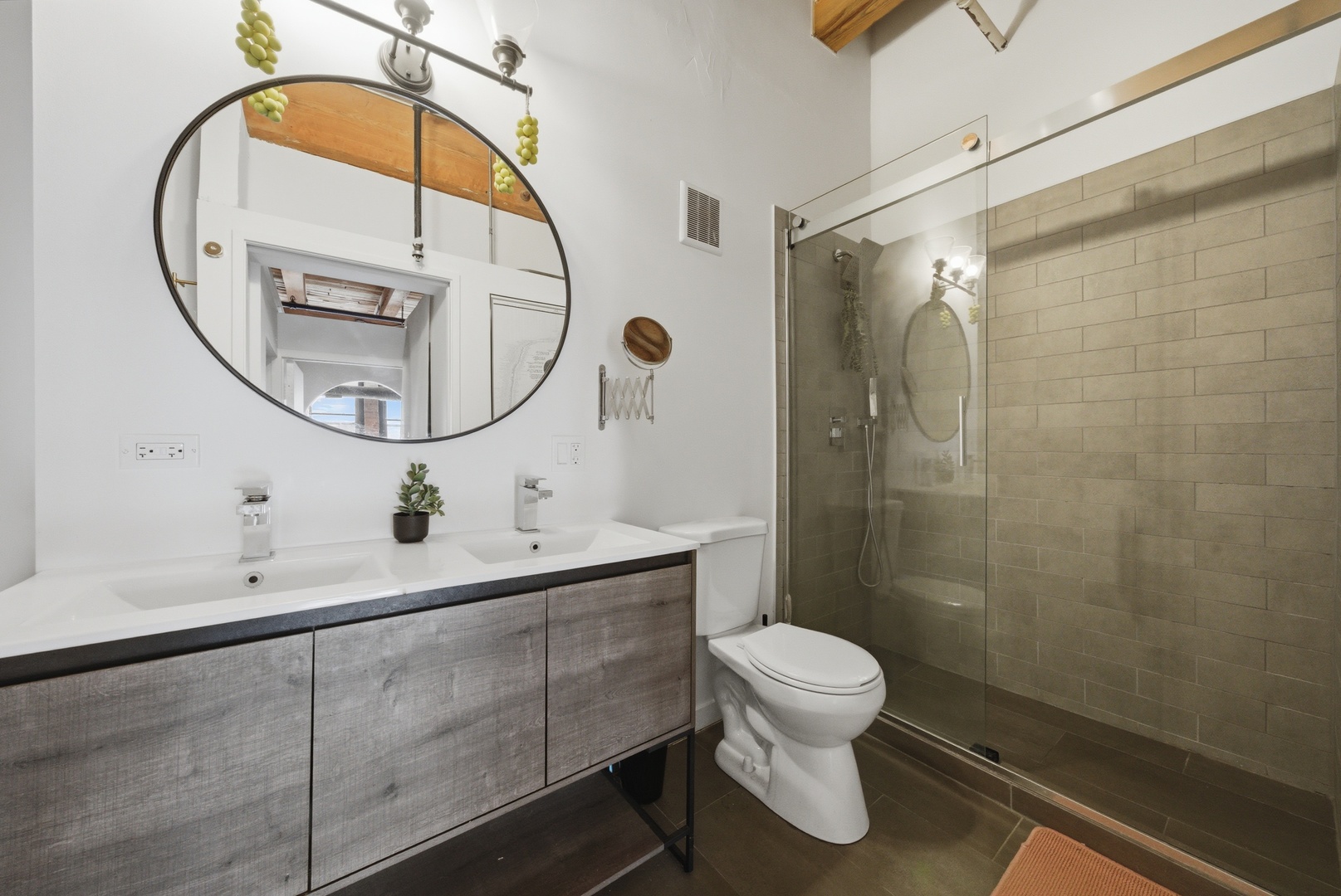400 South Green Street, Unit 310 Chicago, IL 60607 - Photo 33 of 43 a bathroom with a toilet a sink and a mirror