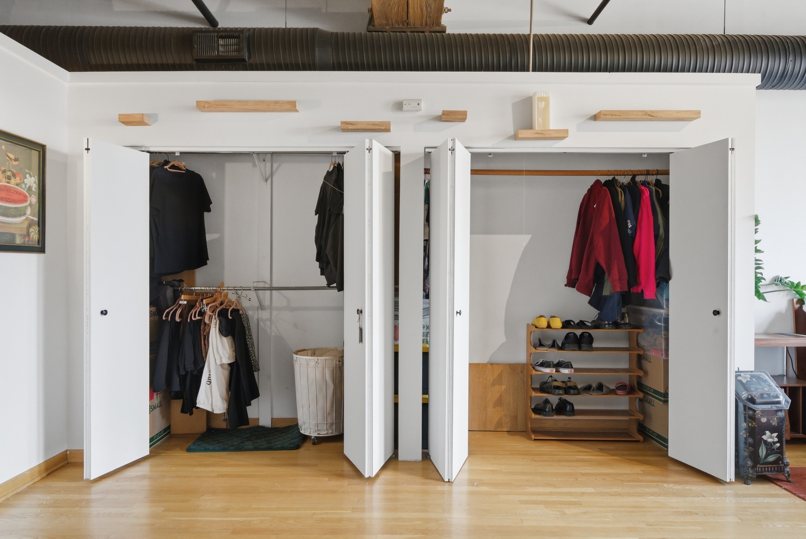 400 South Green Street, Unit 310 Chicago, IL 60607 - Photo 39 of 43 a view of walk in closet with clothes and shoes