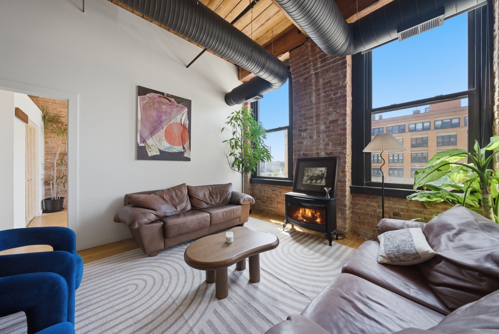 400 South Green Street, Unit 310 Chicago, IL 60607 - Photo 6 of 43 a living room with furniture and a fireplace
