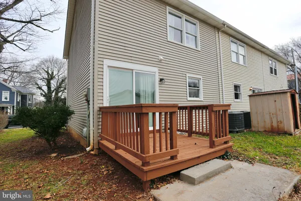 a view of a deck with a small yard