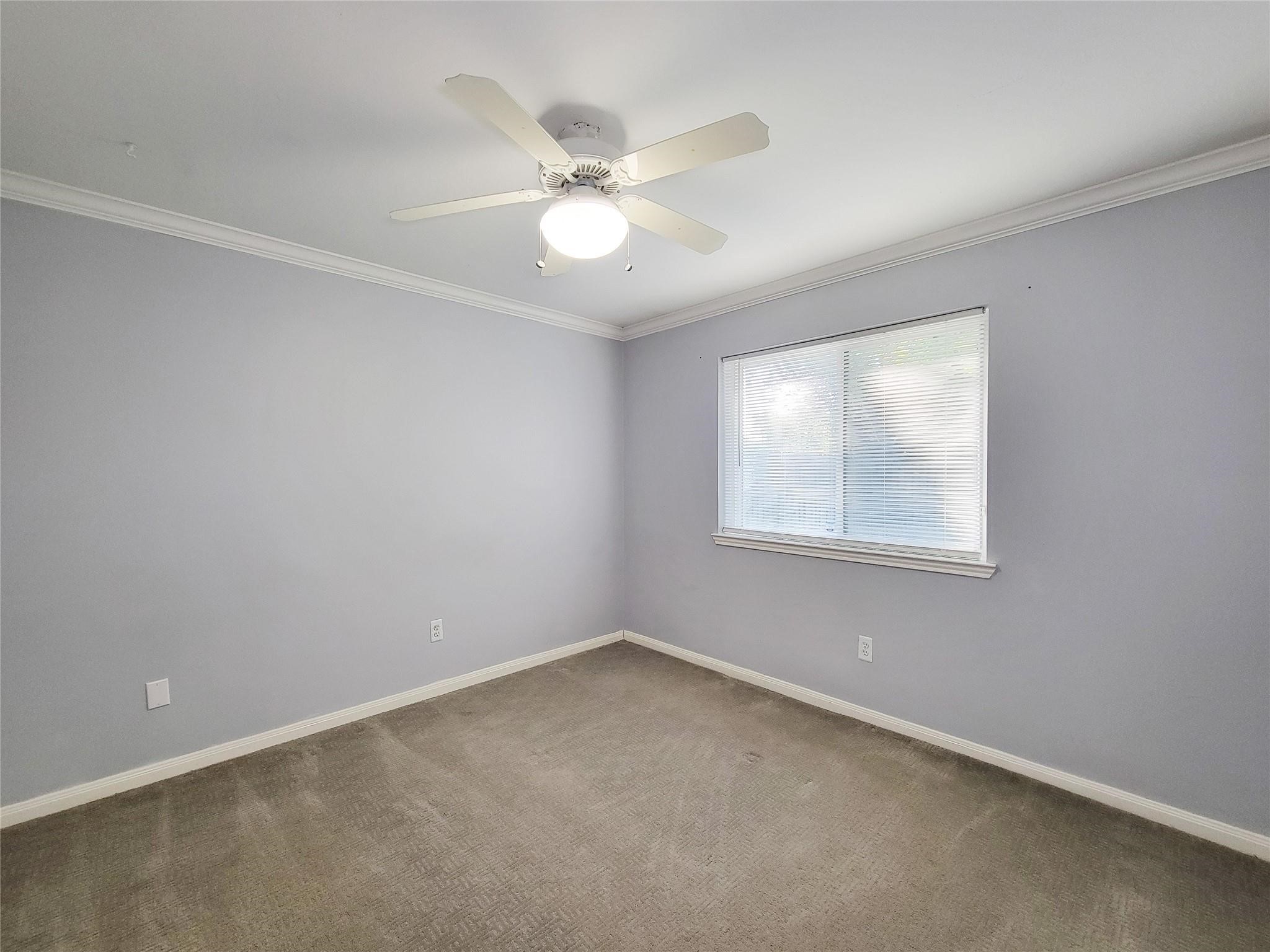 23327 Sandpiper Trail Spring, TX 77373 - Photo 21 of 22 an empty room with a window and a fan