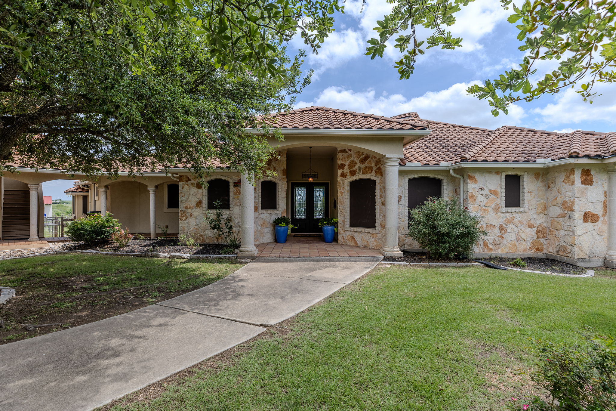front view of a house with a yard
