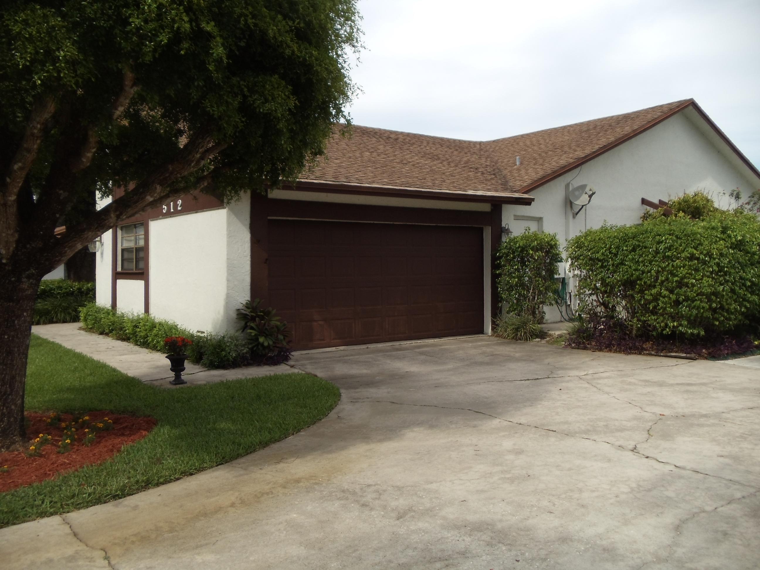 512 Old Country Road South Wellington, FL 33414 - Photo 2 of 28 Side Entry Garage