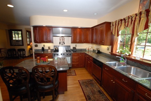 25 Somerset Road Lexington, MA 02420 - Photo 4 of 9 a kitchen with granite countertop a sink a counter top space and stainless steel appliances