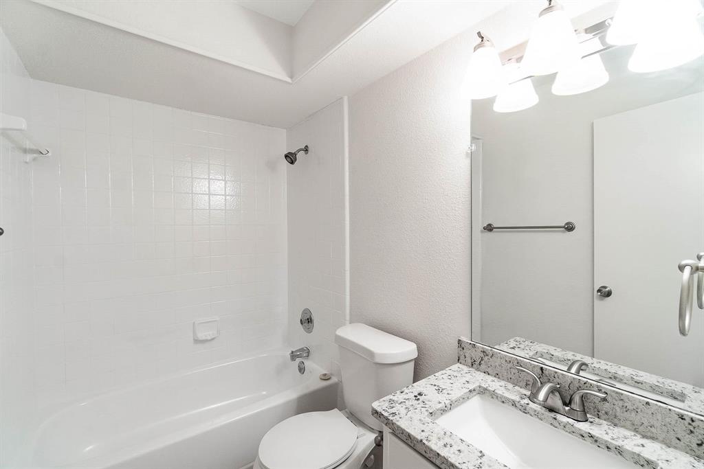 1905 Lansdown Court Carrollton, TX 75010 - Photo 11 of 23 a bathroom with a sink toilet tub and shower