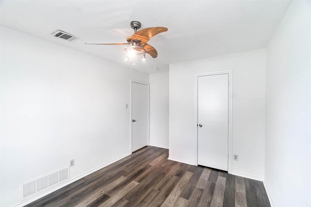 1905 Lansdown Court Carrollton, TX 75010 - Photo 13 of 23 a view of room with hardwood floor and ceiling fan