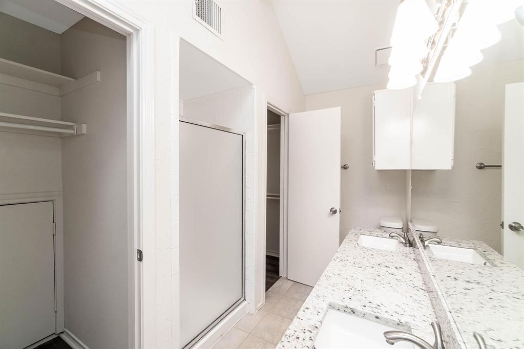 1905 Lansdown Court Carrollton, TX 75010 - Photo 17 of 23 a large bedroom with a bed and a closet