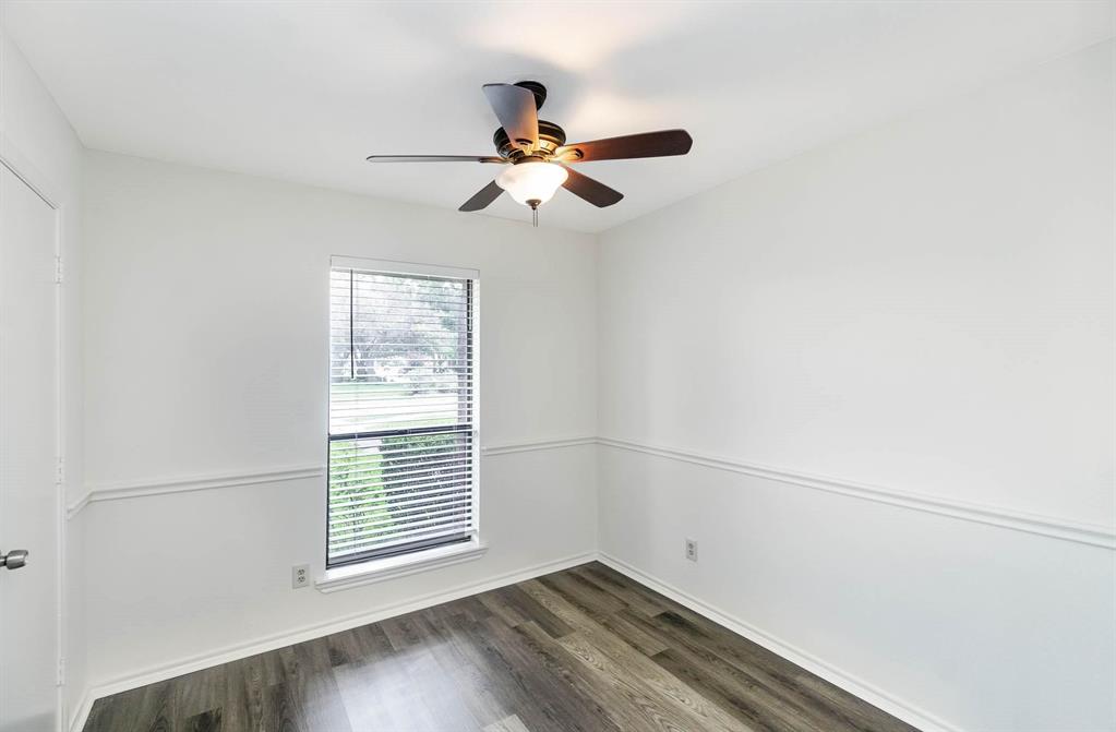 1905 Lansdown Court Carrollton, TX 75010 - Photo 8 of 23 a view of a room with a ceiling fan and a window