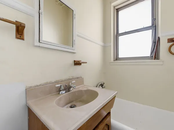 a bathroom with a sink and a bathtub