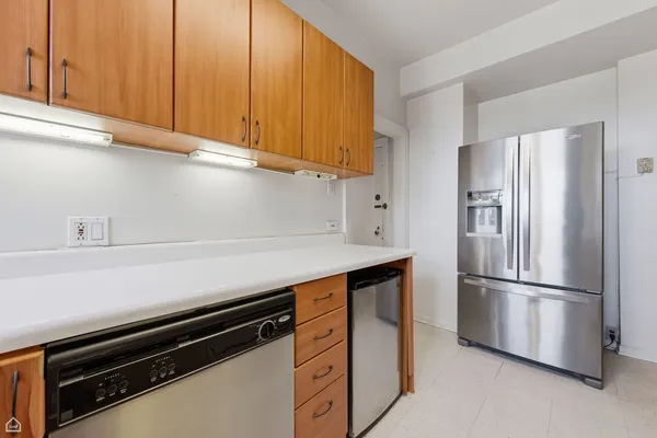 a kitchen with stainless steel appliances a refrigerator and a sink