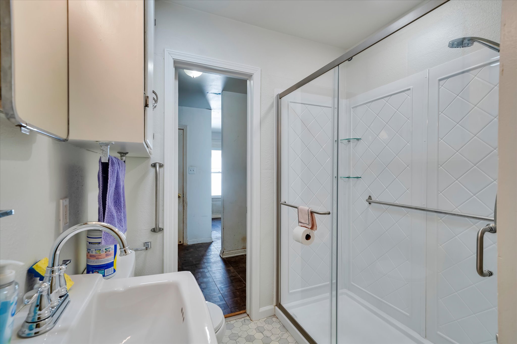 1206 Ruth Avenue Austin, TX 78757 - Photo 13 of 37 a bathroom with a sink a toilet and shower