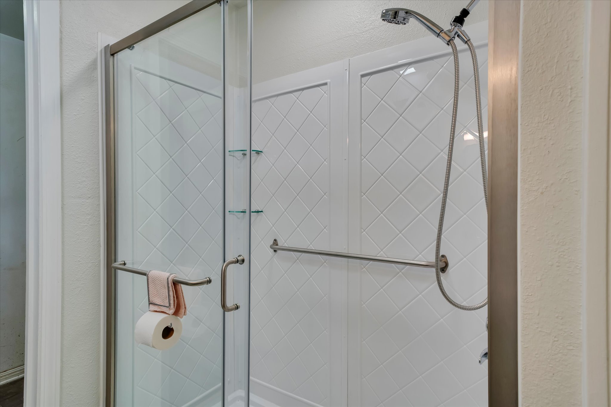 1206 Ruth Avenue Austin, TX 78757 - Photo 14 of 37 a bathroom with a glass shower door