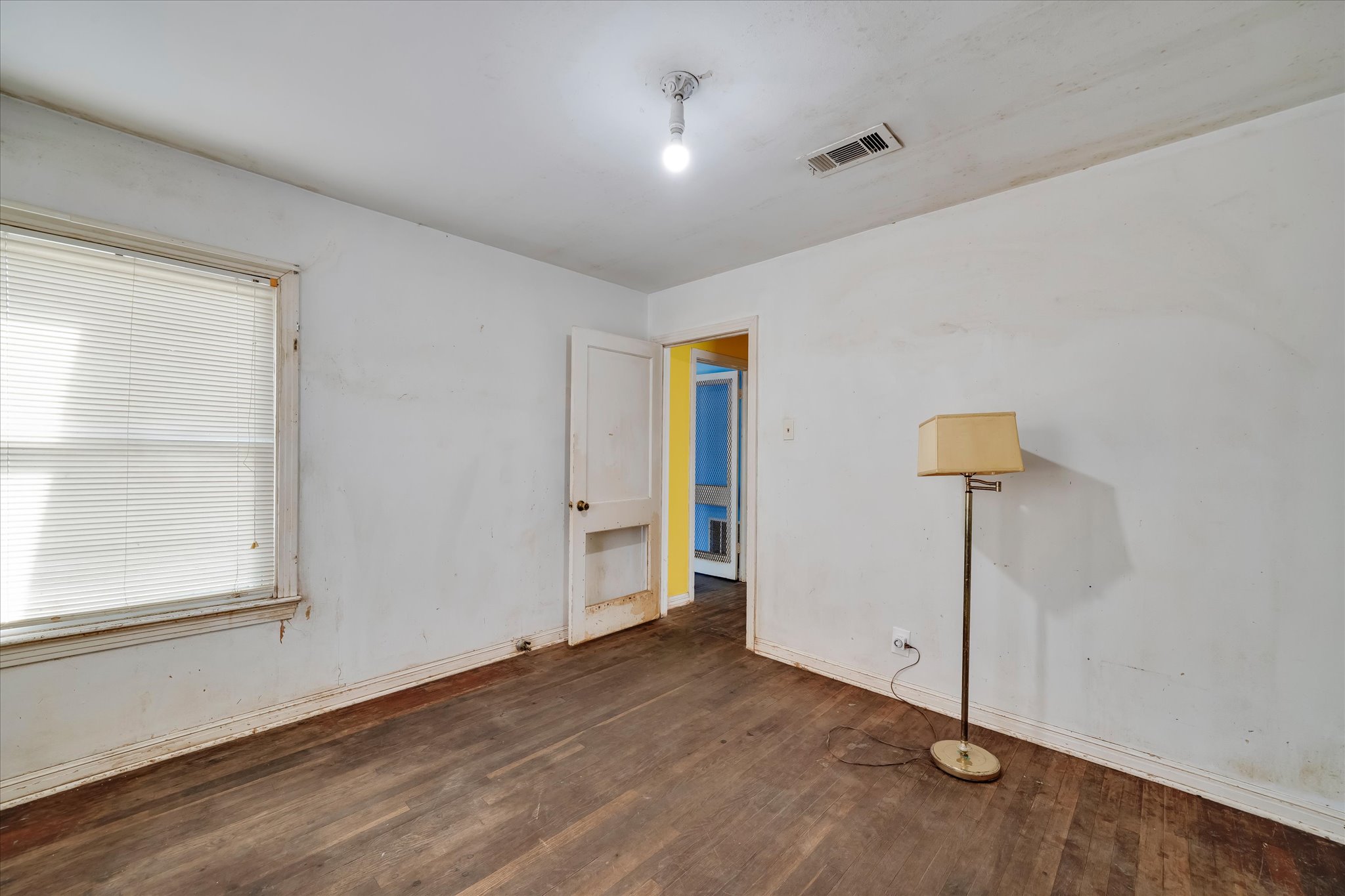 1206 Ruth Avenue Austin, TX 78757 - Photo 20 of 37 wooden floor in an empty room with a window