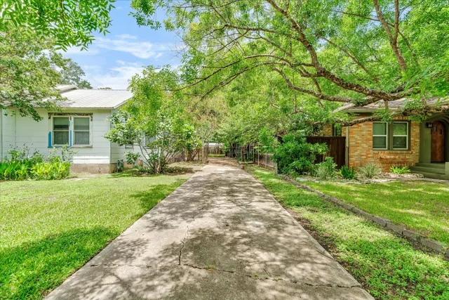 a house with trees in the background
