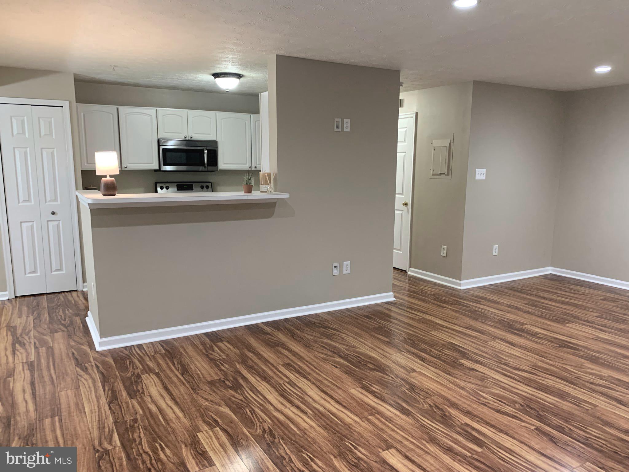 7907 Valley Manor Road, Unit 103 Owings Mills, MD 21117 - Photo 7 of 32 Living Room/Kitchen
