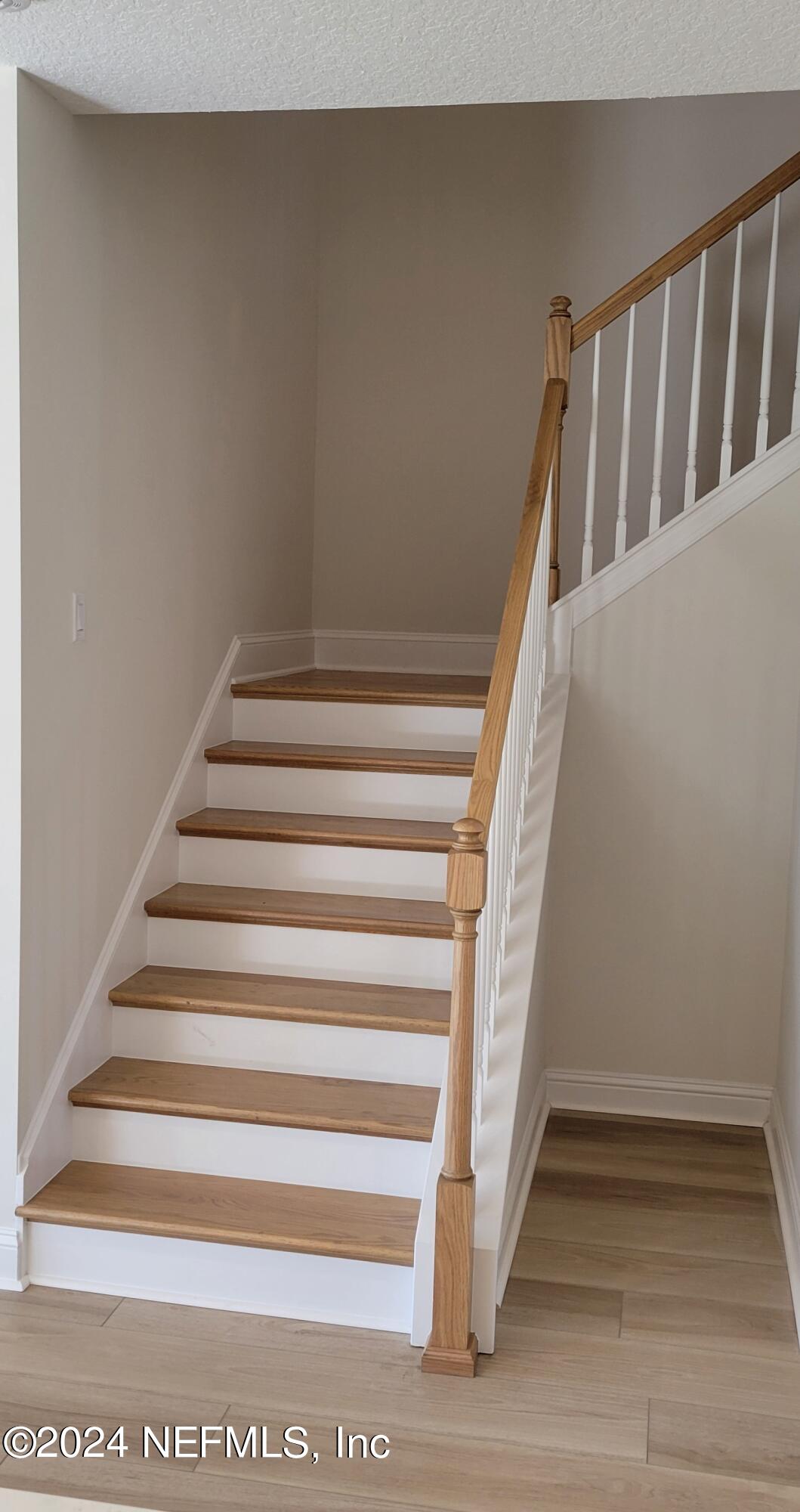 435 Hillendale Circle St. Johns, FL 32259 - Photo 50 of 100 Oak Stairs with open railing off kitchen