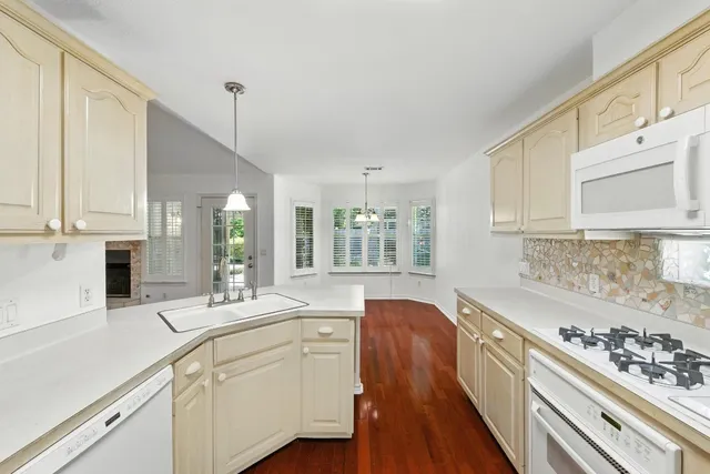 a kitchen with sink cabinets and stove