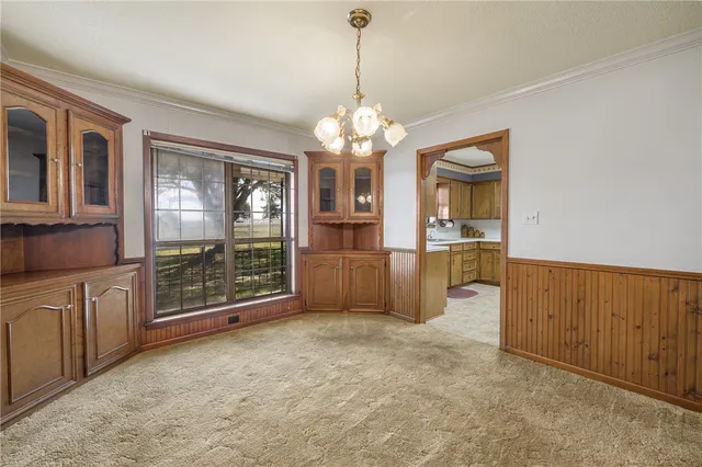 a view of a kitchen with granite countertop cabinets and window