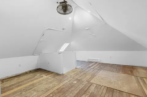 a view of a room that has a lot of cabinets