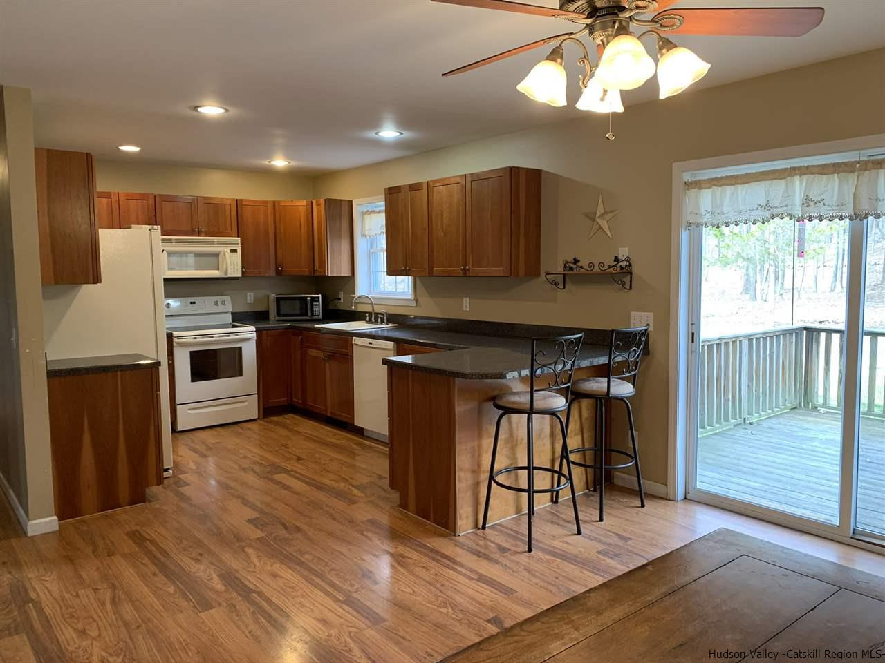 14 Beecher Hill Road Wallkill, NY 12589 - Photo 6 of 35 a kitchen with stainless steel appliances granite countertop a stove top oven a sink and a refrigerator