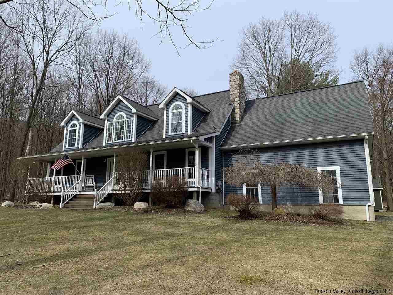 14 Beecher Hill Road Wallkill, NY 12589 - Photo 8 of 35 a front view of a house with a garden and plants