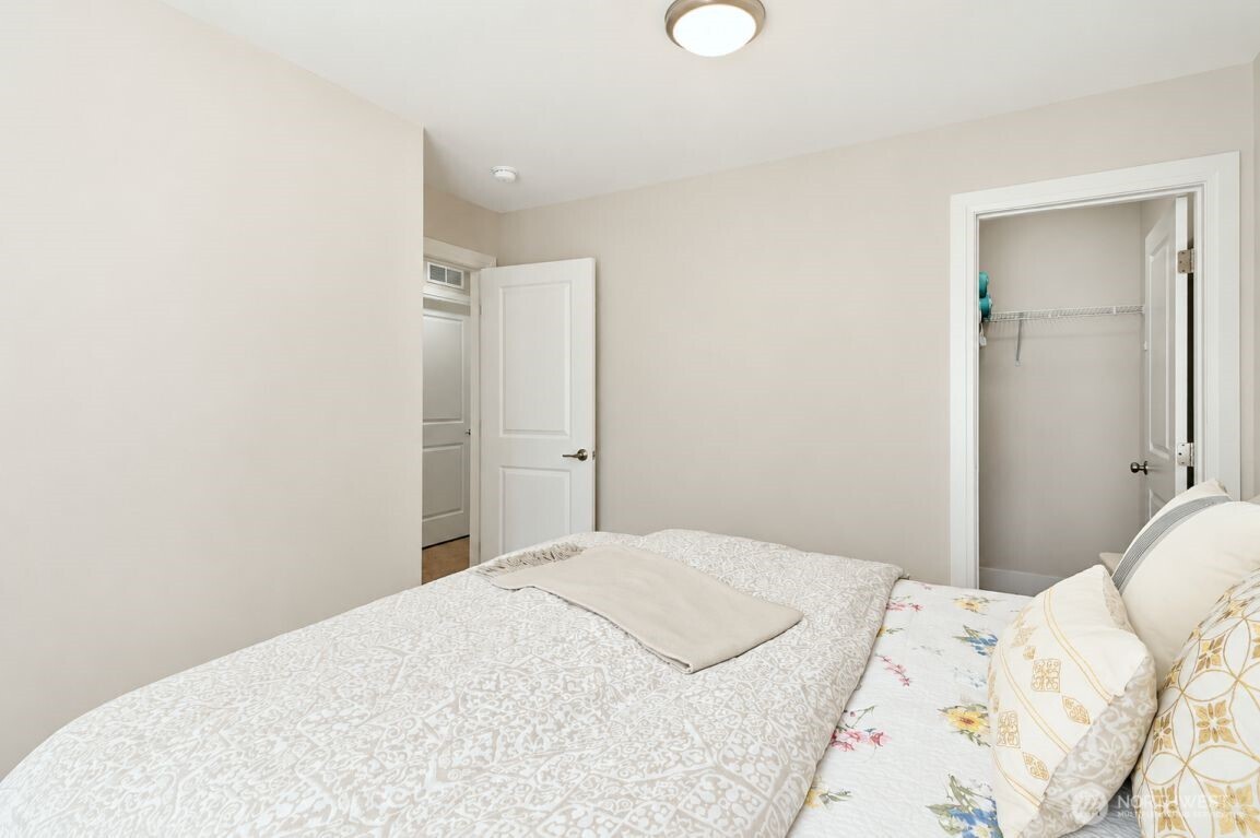 19607 25th Drive Southeast Bothell, WA 98012 - Photo 19 of 30 a bedroom with a bed and a mirror