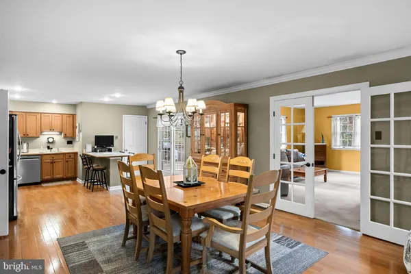 a living room with furniture and a lamp