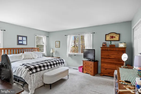 a bedroom with a bed and a desk