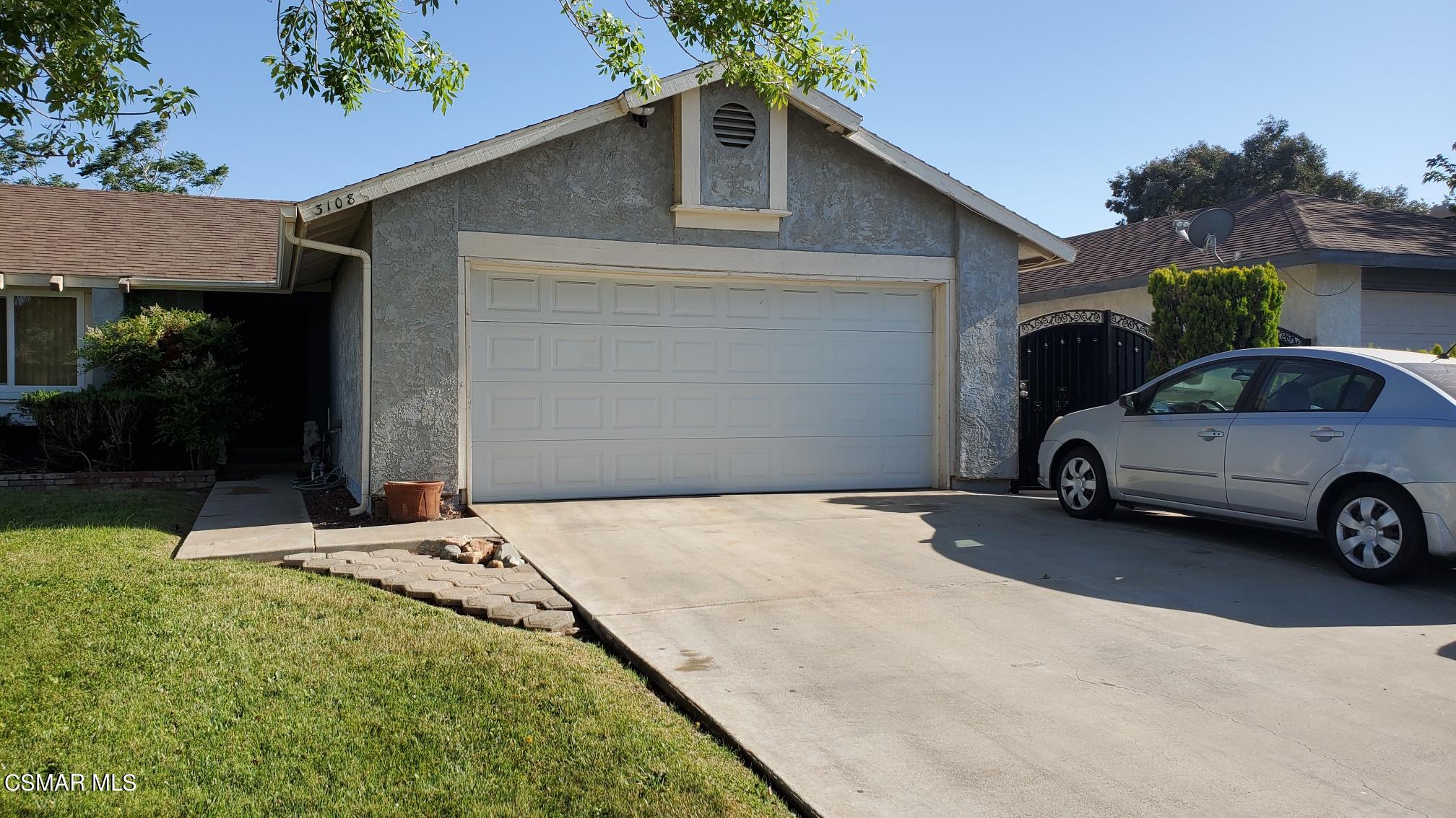 3108 East Avenue R4 Palmdale, CA 93550 - Photo 2 of 2 a view of a car parked in front of a house