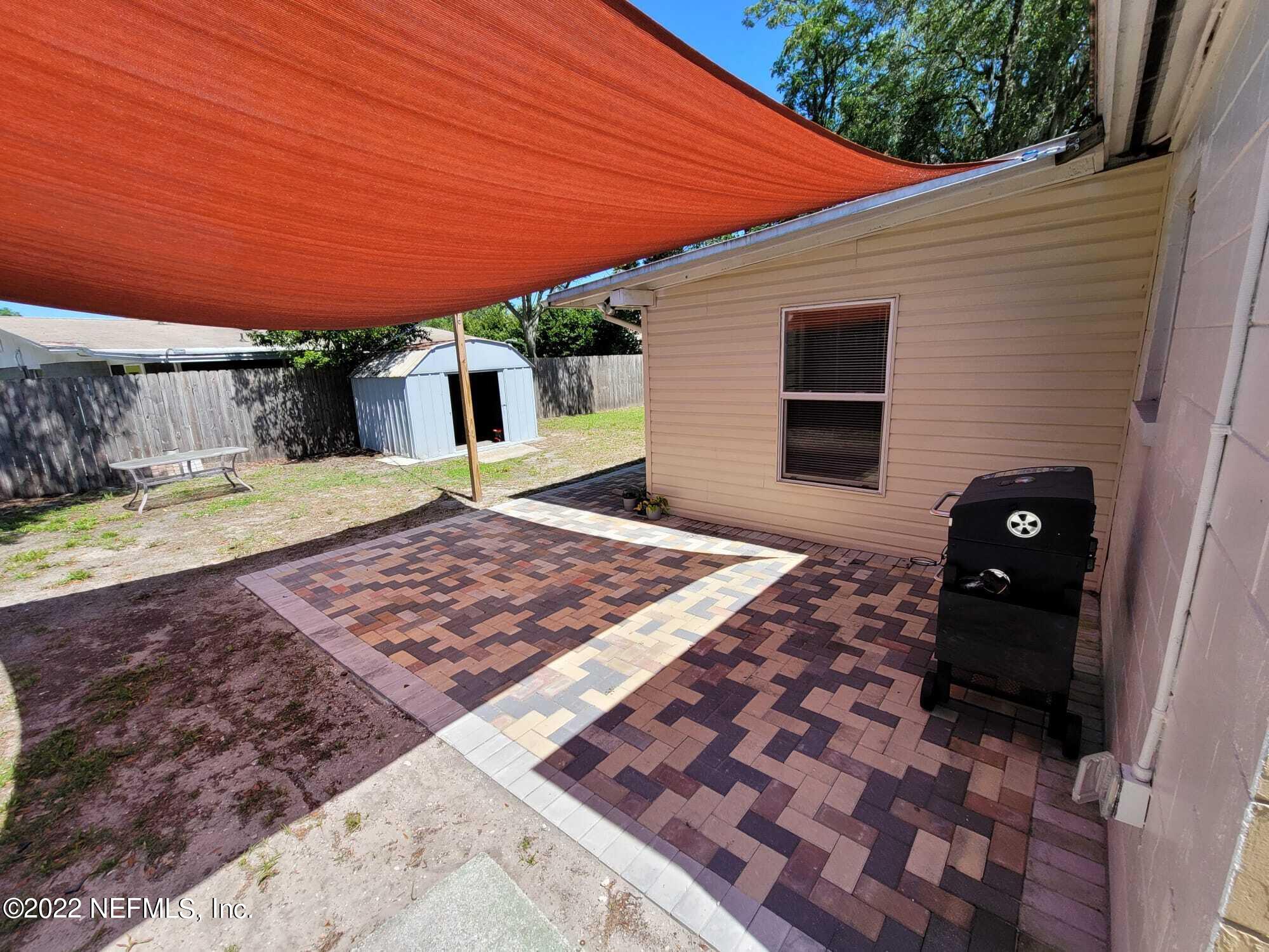 7371 Wheat Road Jacksonville, FL 32244 - Photo 14 of 28 Partially paved backyard