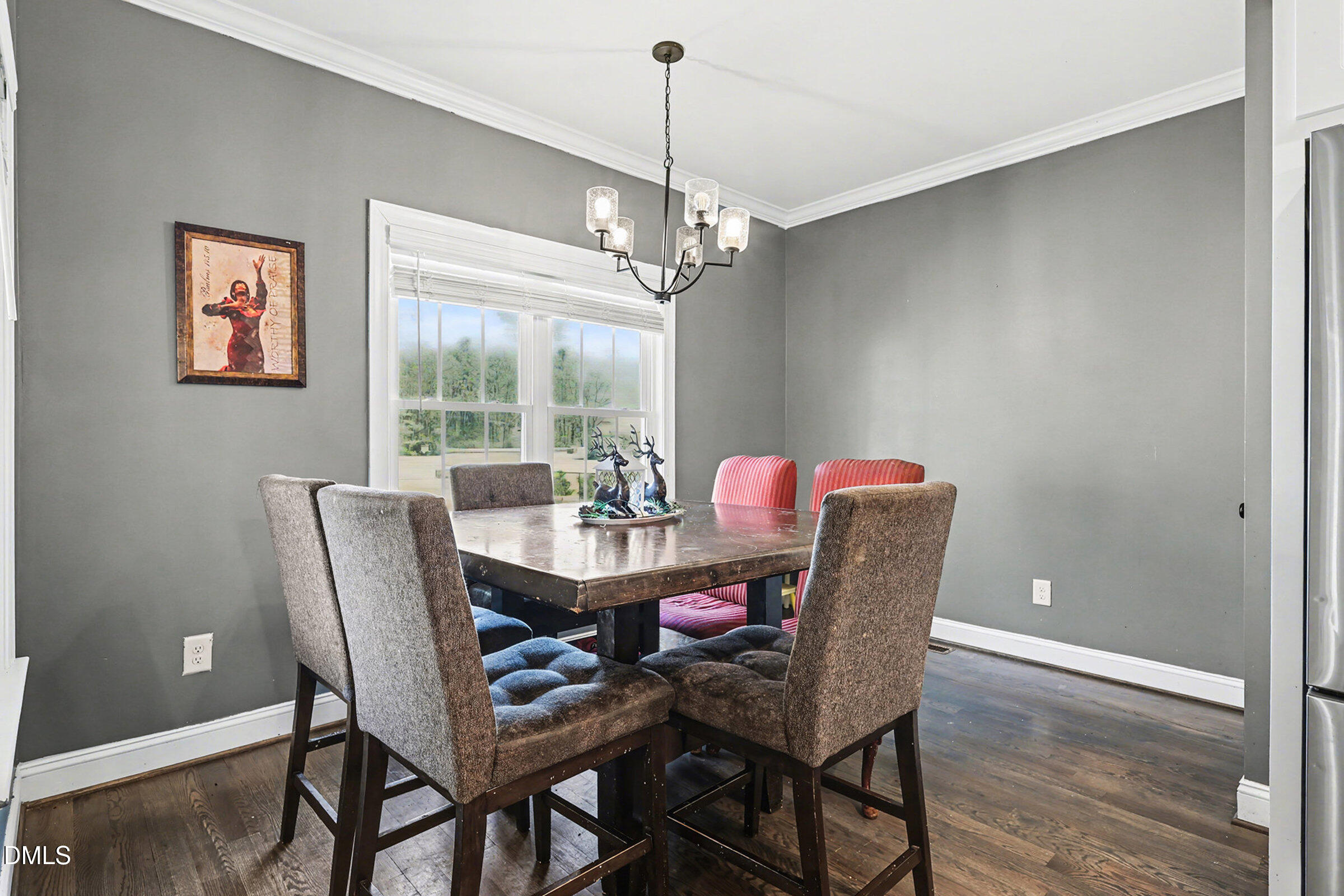 5117 Joe Ellen Road Battleboro, NC 27809 - Photo 10 of 23 a dining room with furniture a chandelier and window