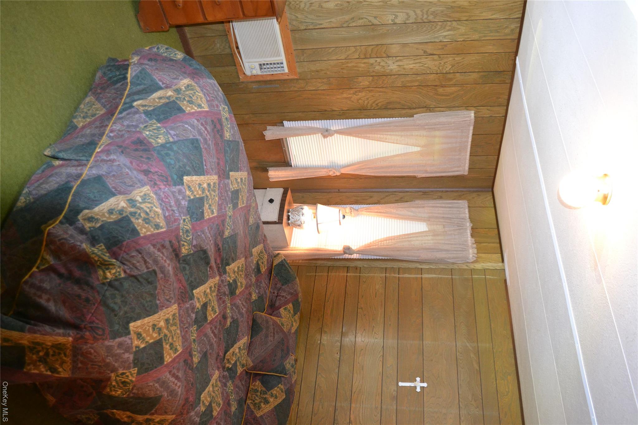 113 Lake Muskoday Road Roscoe, NY 12776 - Photo 11 of 27 Primary bedroom with wall A/C and 4 custom windows