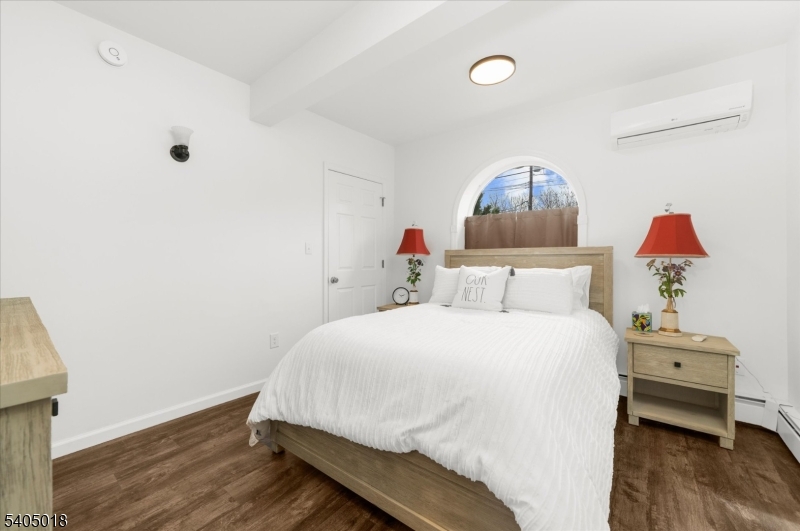 128 East Main Street Lebanon, NJ 08833 - Photo 15 of 36 a bedroom with a bed and wooden floor