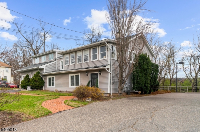 128 East Main Street Lebanon, NJ 08833 - Photo 2 of 36 a front view of a house with a yard