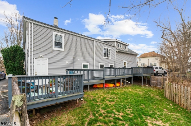 128 East Main Street Lebanon, NJ 08833 - Photo 33 of 36 a view of a house with wooden deck and a yard