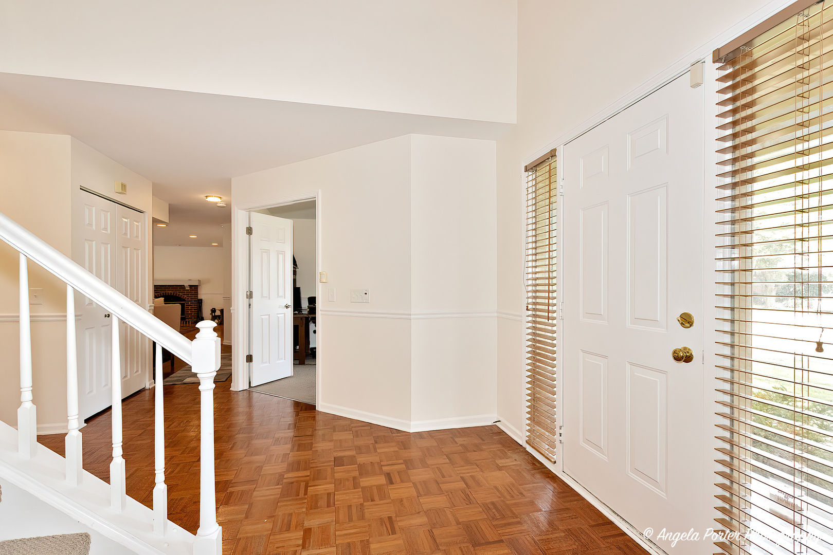 600 Raintree Road Buffalo Grove, IL 60089 - Photo 14 of 46 a view of entryway with wooden floor and stairs