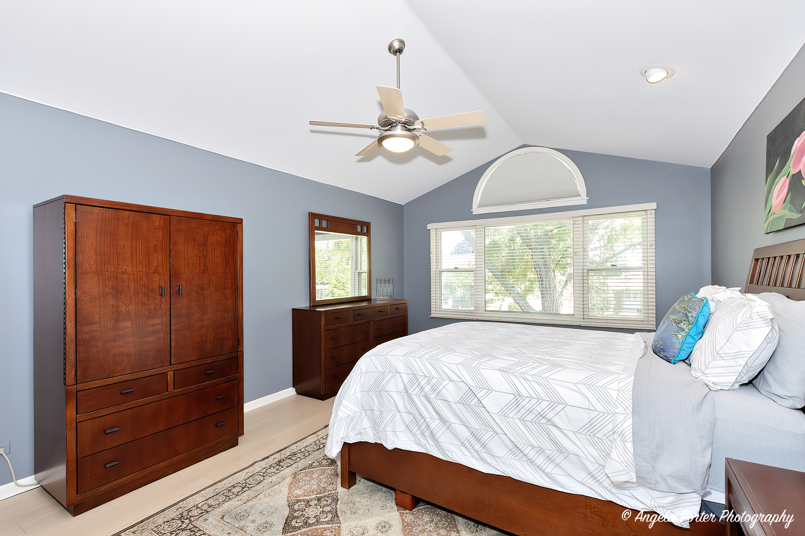600 Raintree Road Buffalo Grove, IL 60089 - Photo 23 of 46 a bedroom with a bed and a chandelier