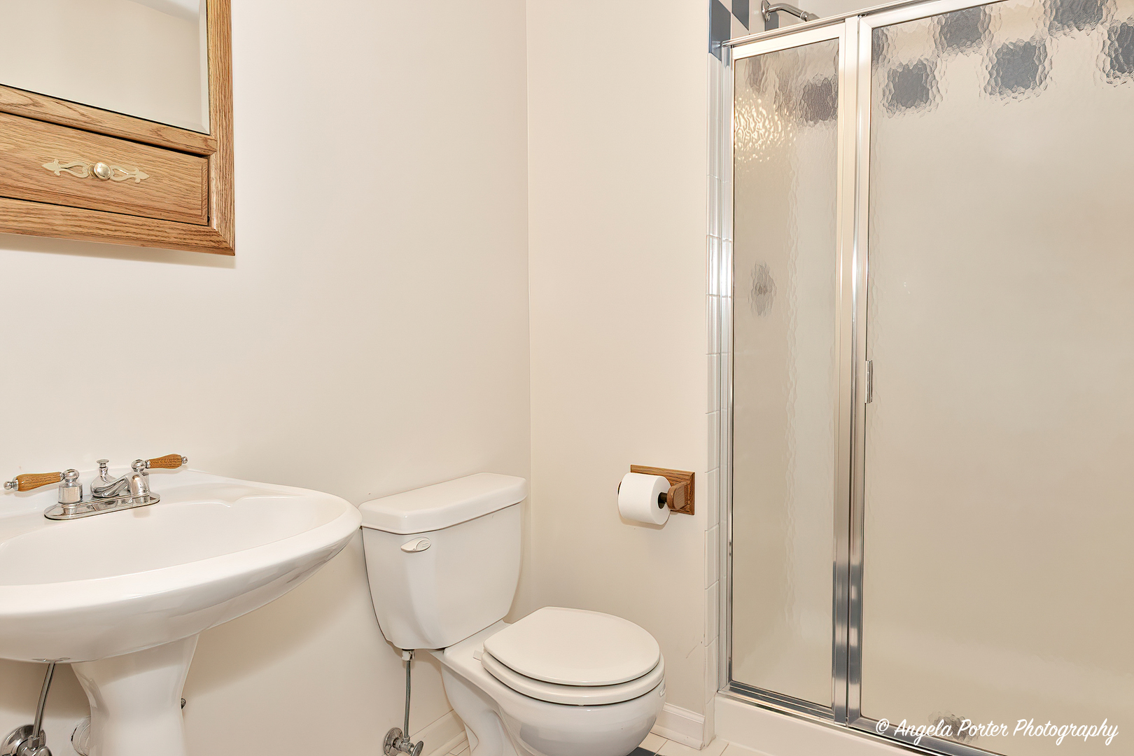 600 Raintree Road Buffalo Grove, IL 60089 - Photo 39 of 46 a white toilet sitting next to a bathroom sink