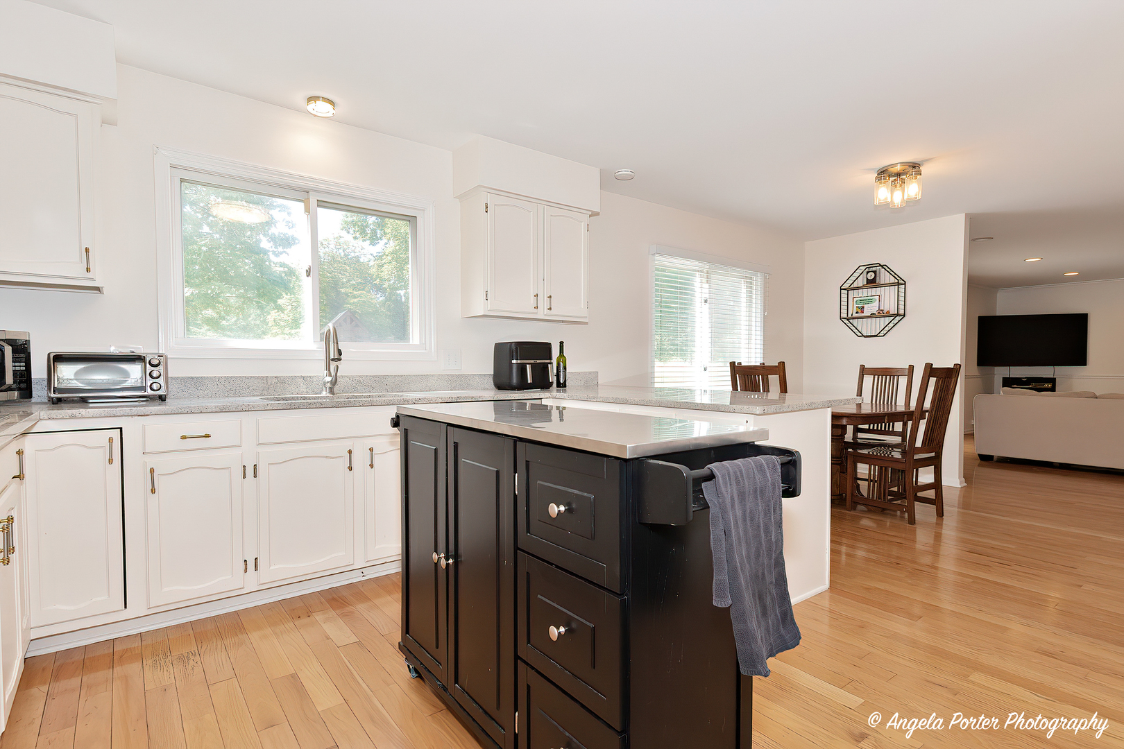 600 Raintree Road Buffalo Grove, IL 60089 - Photo 4 of 46 a kitchen with a sink cabinets and window