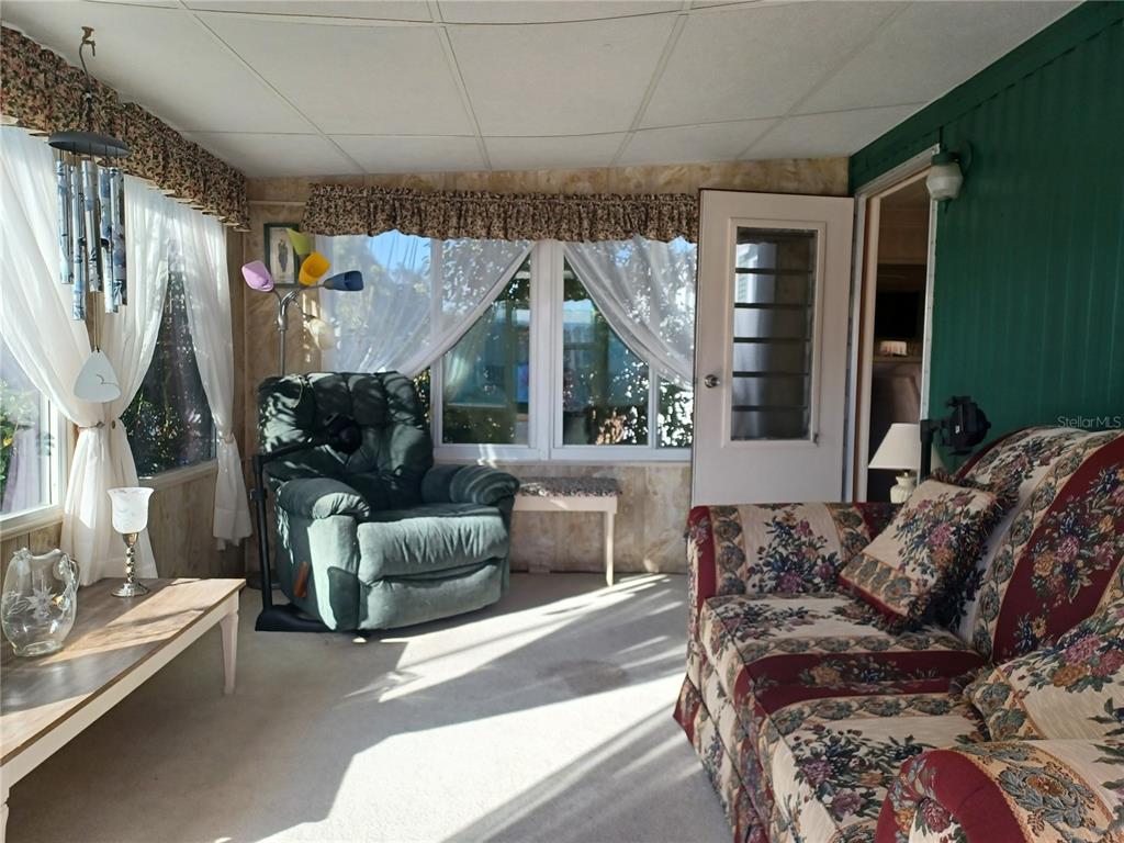 34701 Rosebud Row Zephyrhills, FL 33541 - Photo 11 of 12 a living room with furniture and a large window