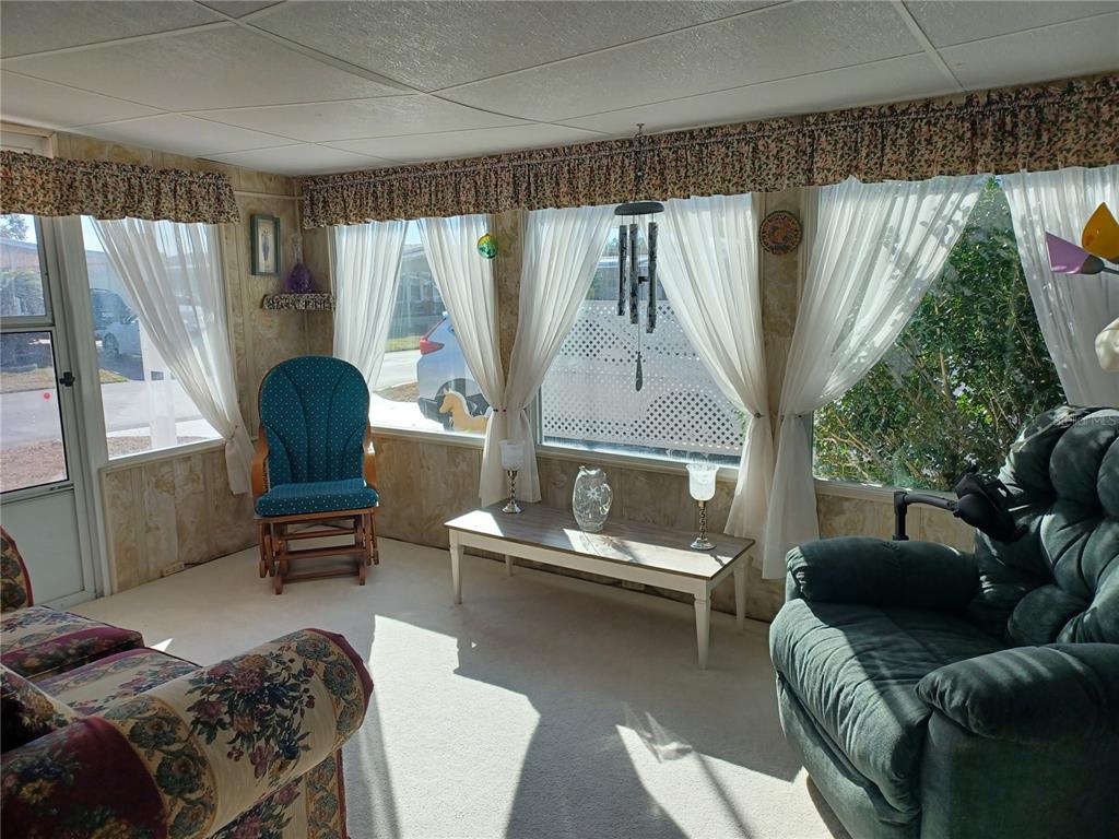 34701 Rosebud Row Zephyrhills, FL 33541 - Photo 12 of 12 a living room with furniture and a window