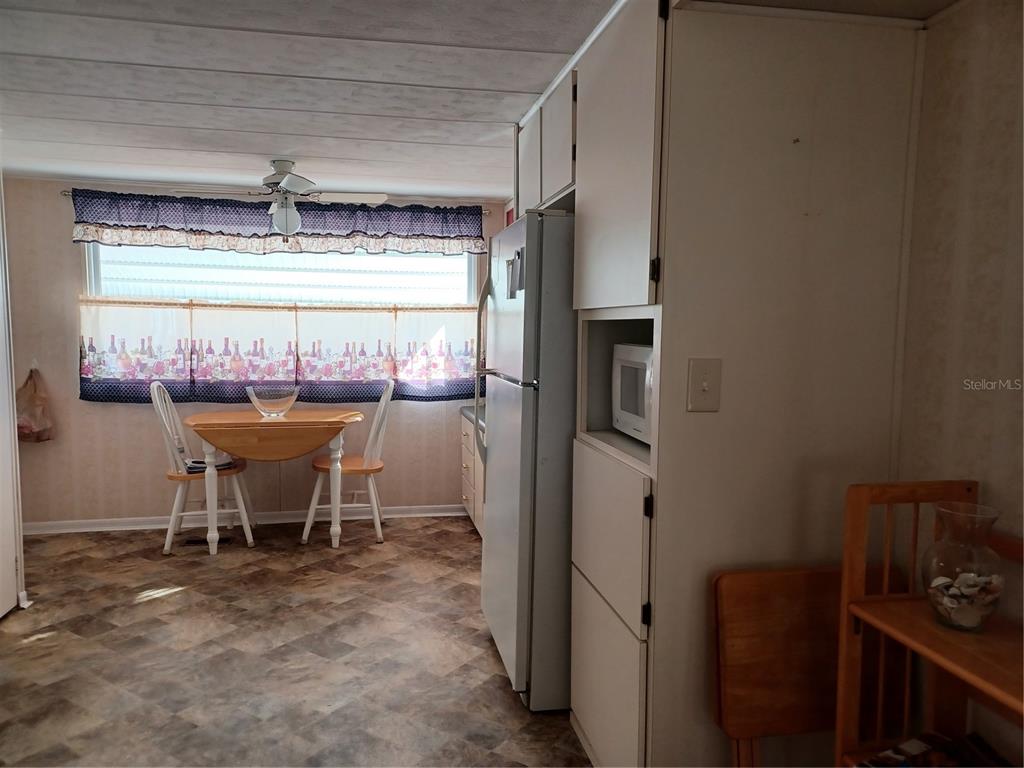 34701 Rosebud Row Zephyrhills, FL 33541 - Photo 2 of 12 a dining room with furniture and a window