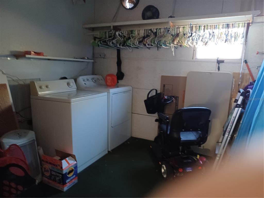 34701 Rosebud Row Zephyrhills, FL 33541 - Photo 4 of 12 a room with storage and utility