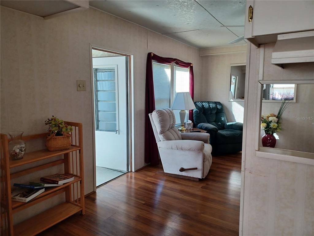 34701 Rosebud Row Zephyrhills, FL 33541 - Photo 10 of 12 a living room with furniture and wooden floor