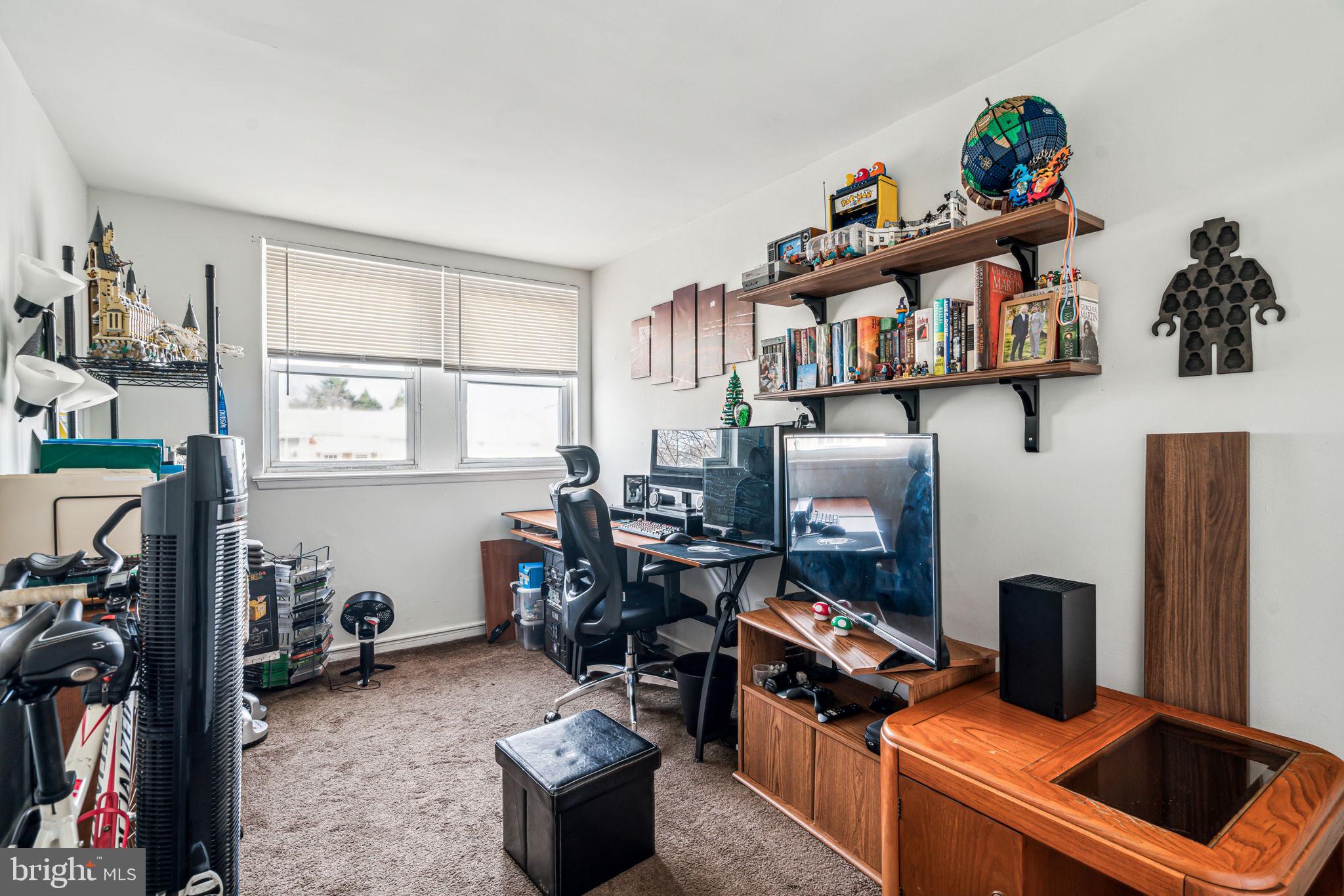 10203 East Keswick Road Philadelphia, PA 19114 - Photo 27 of 36 a room with furniture a rug and a window