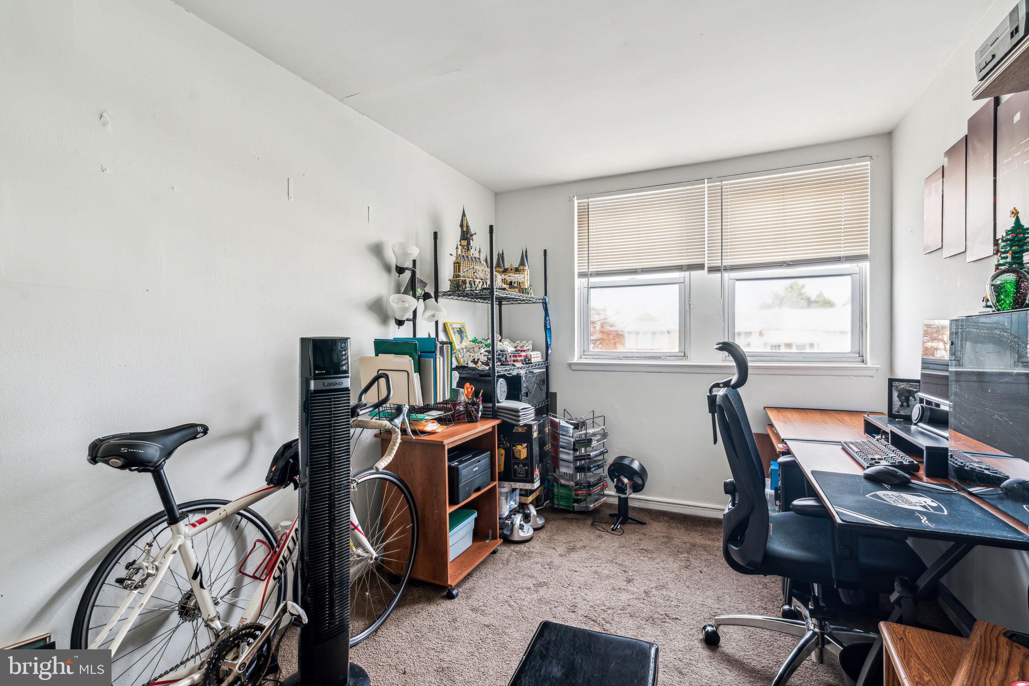 10203 East Keswick Road Philadelphia, PA 19114 - Photo 28 of 36 a view of a workspace with furniture and a window