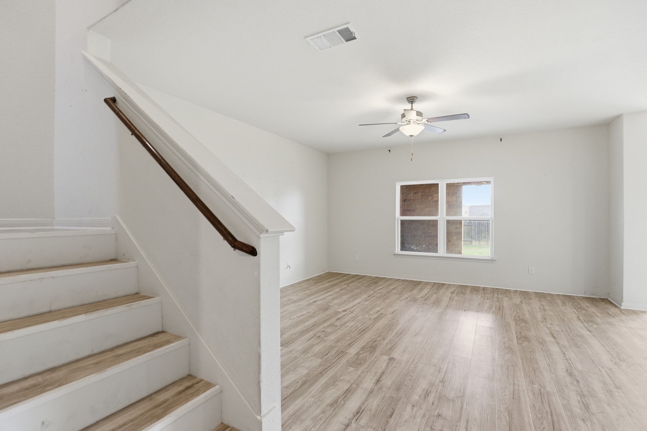 300 Hyacinth Way Jarrell, TX 76537 - Photo 7 of 37 a view of entryway and hall with wooden floor