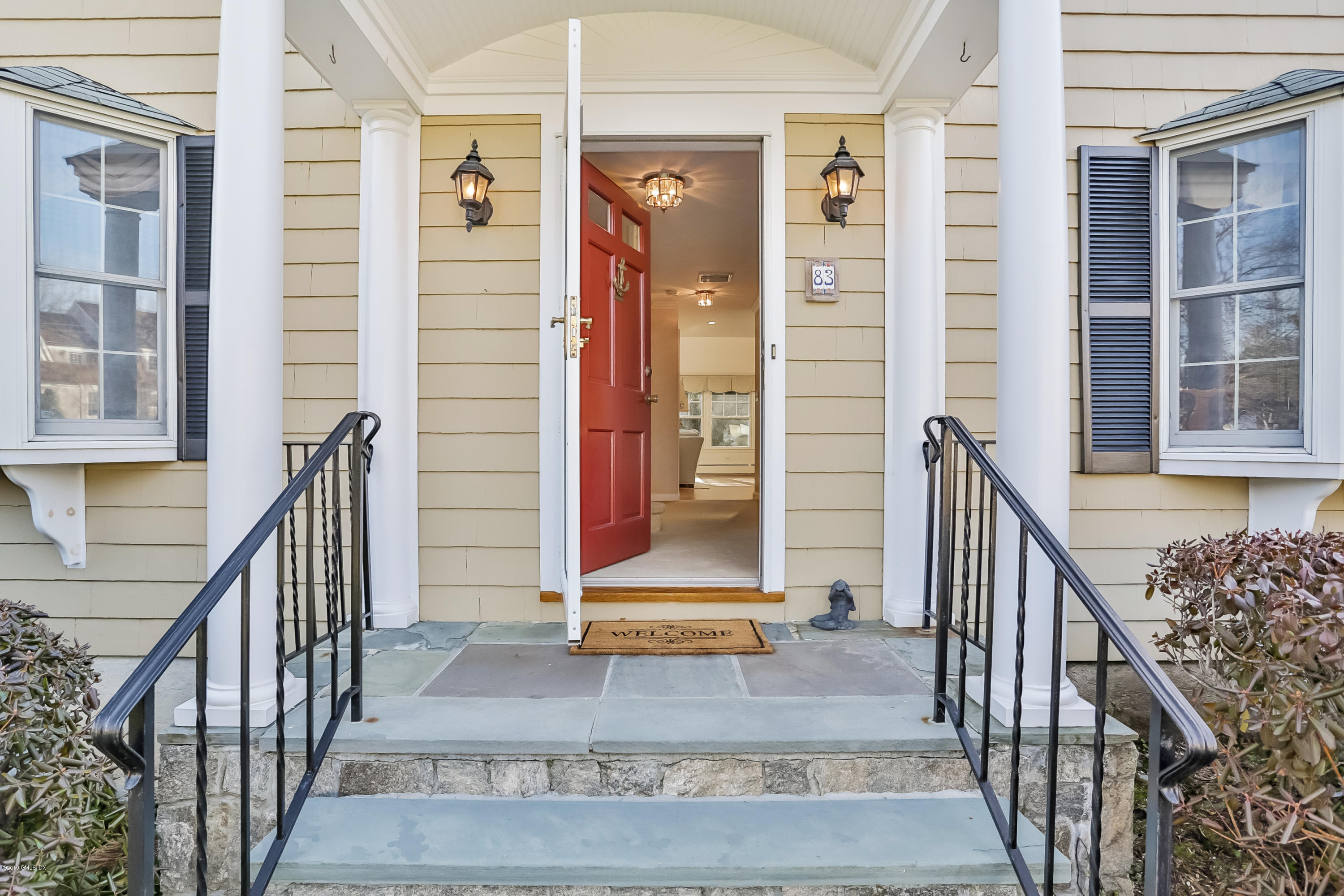 83 Winthrop Drive Riverside, CT 06878 - Photo 3 of 21 an entryway with wooden floor and windows