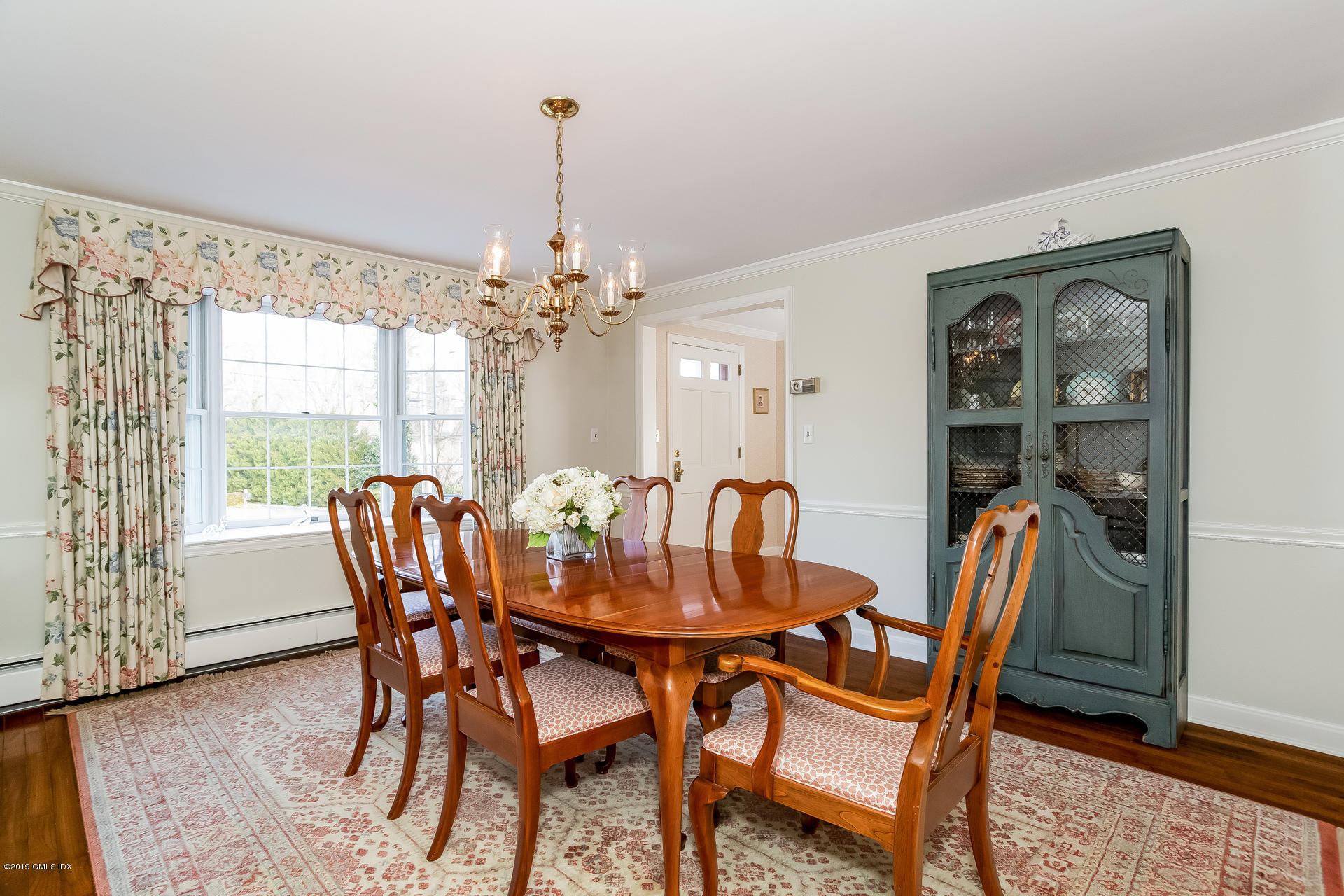 83 Winthrop Drive Riverside, CT 06878 - Photo 4 of 21 a dining room with furniture a chandelier and wooden floor